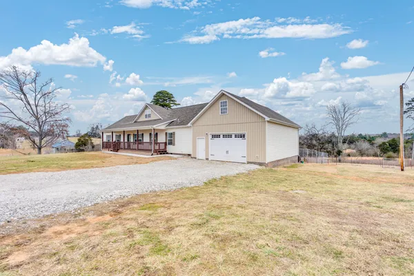 a view of a house with snow on the ground and yard