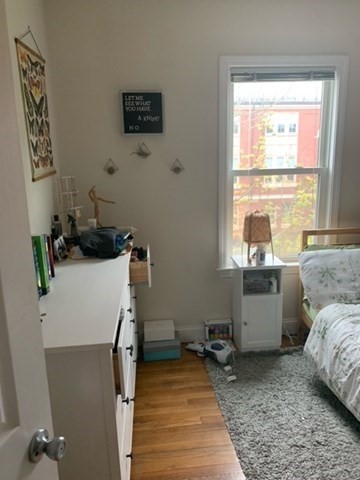 14 Homer Street, Unit 3 Brookline, MA 02445 - Photo 8 of 10 a room with a window and gym equipment