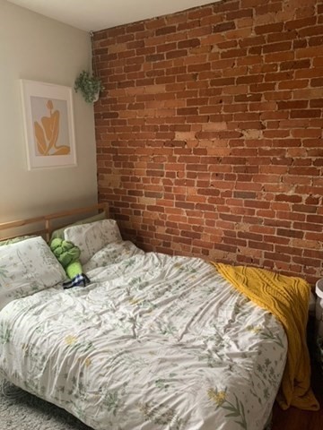 14 Homer Street, Unit 3 Brookline, MA 02445 - Photo 9 of 10 a bedroom with a bed