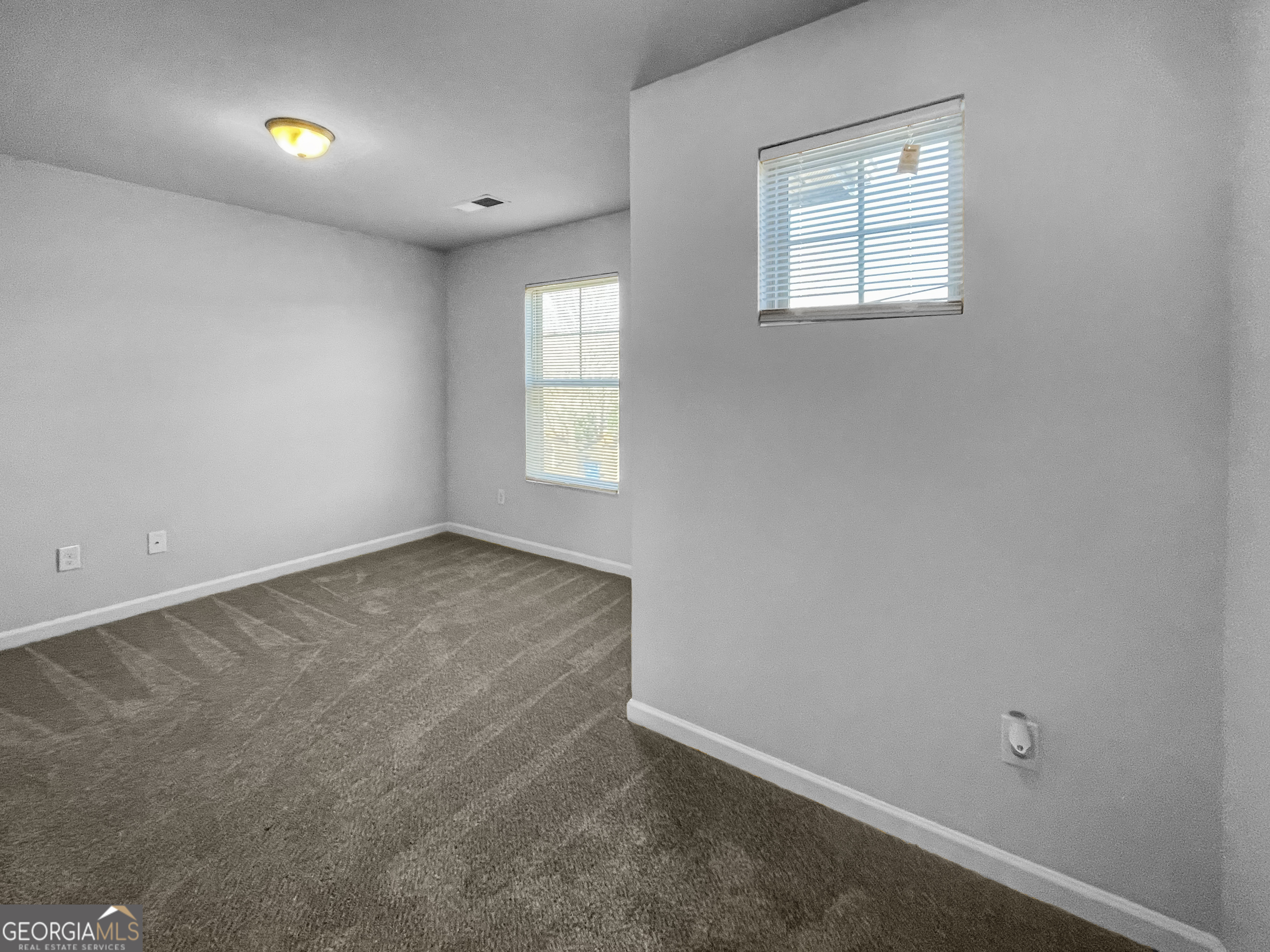116 Daisy Circle McDonough, GA 30252 - Photo 14 of 18 an empty room with windows