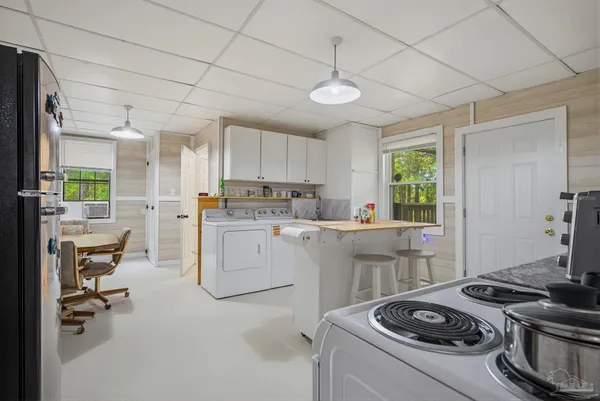 a kitchen that has a cabinets stove and a sink