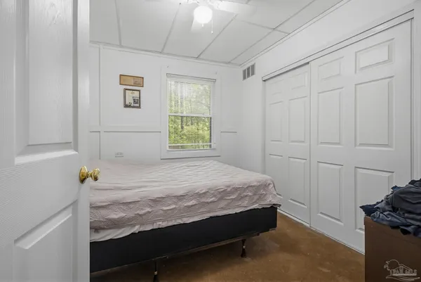 a room with a bed and a window