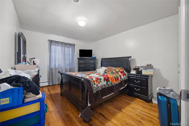 a bed room with a bed and a television