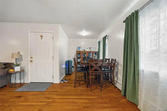 a bathroom with a toilet sink vanity granite and shower