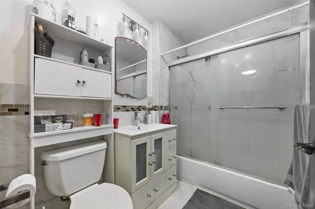 a kitchen with stainless steel appliances granite countertop a sink a stove a cabinets and wooden floors