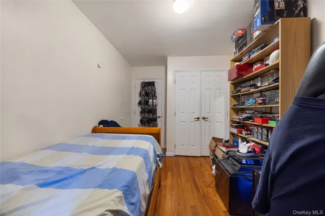 a bedroom with a bed and a closet