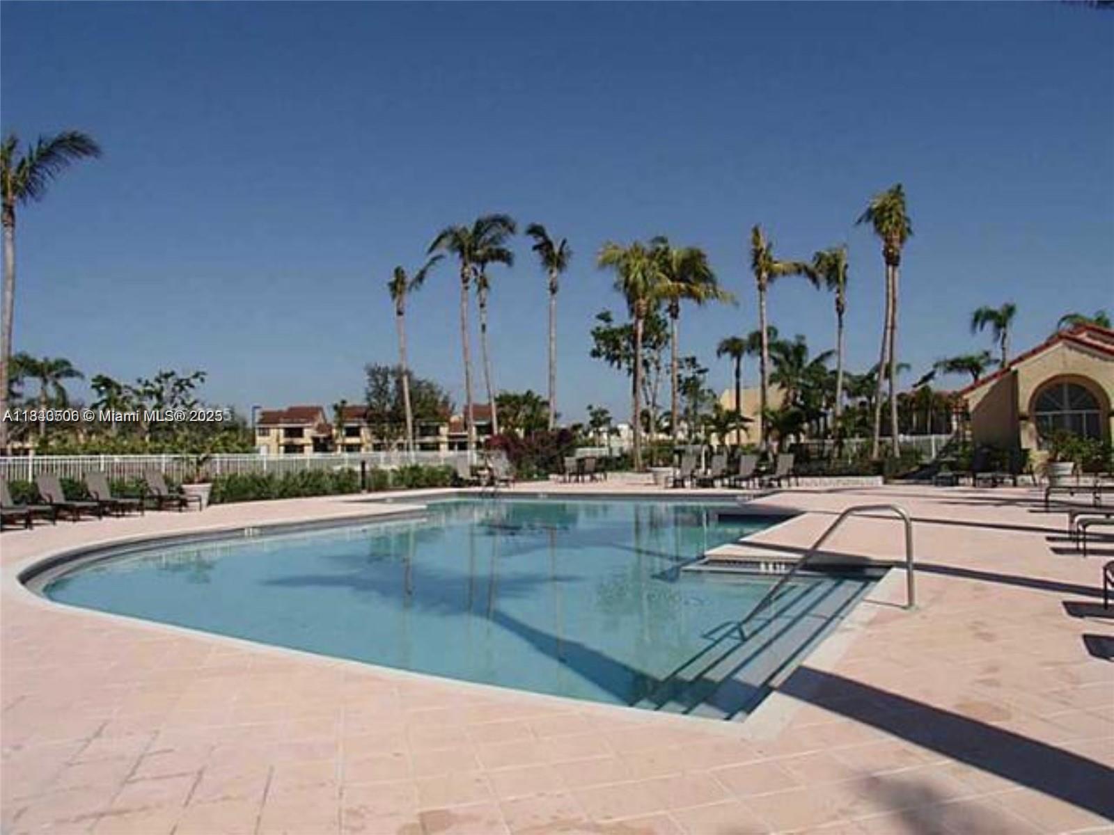 651 Lyons Road, Unit 10201 Coconut Creek, FL 33063 - Photo 3 of 16 a view of swimming pool