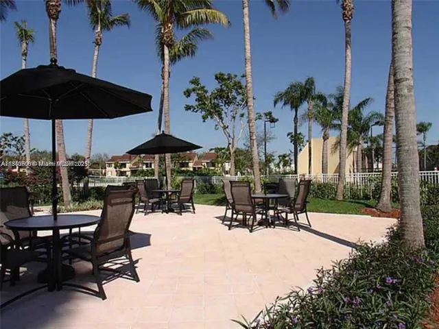 a view of swimming pool with outdoor seating