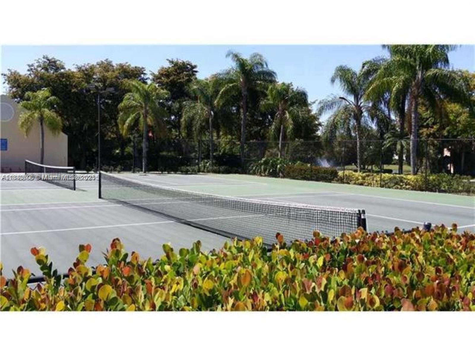 651 Lyons Road, Unit 10201 Coconut Creek, FL 33063 - Photo 8 of 16 a view of a terrace