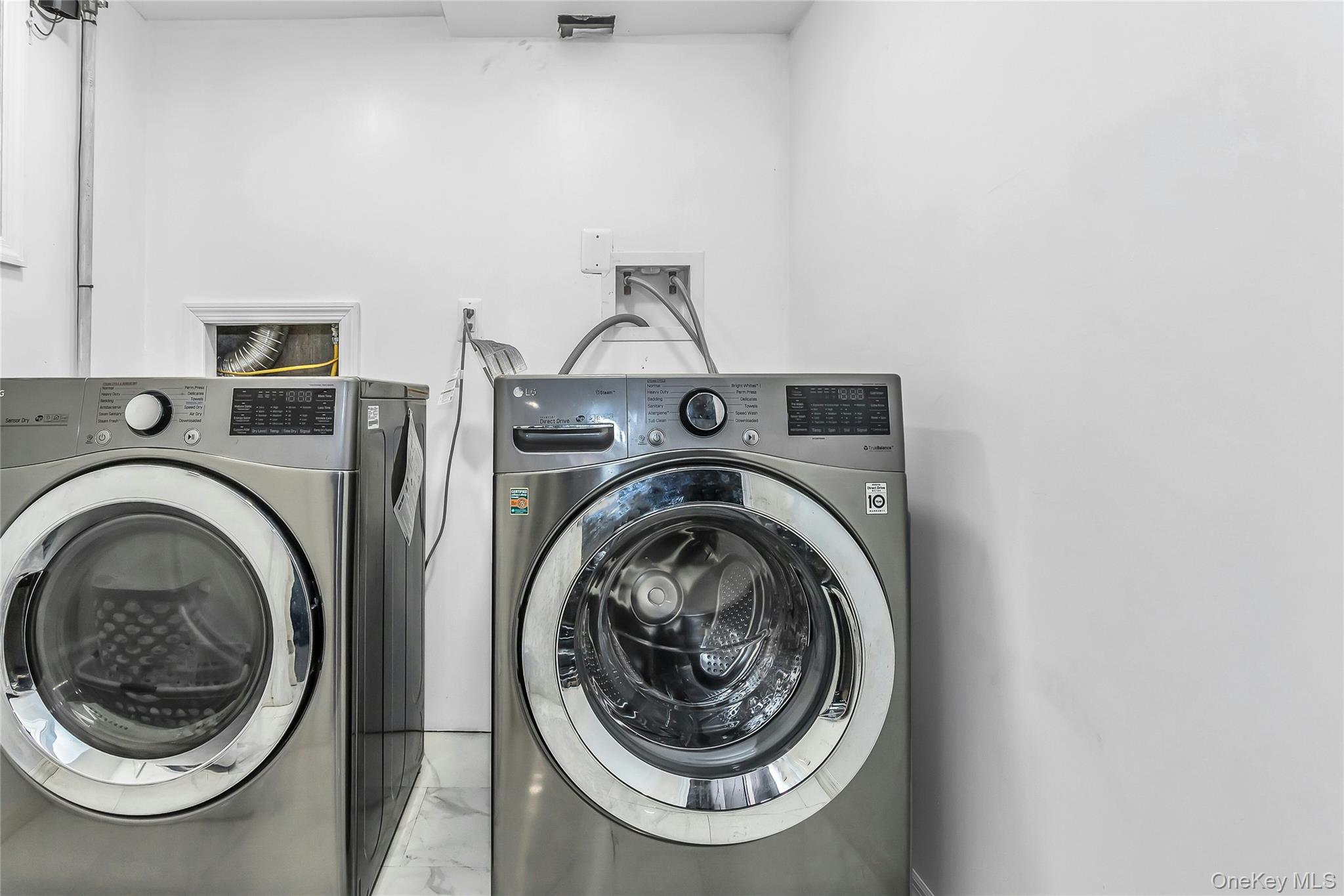 103 Union Street Valley Stream, NY 11580 - Photo 14 of 19 a utility room with dryer and washer