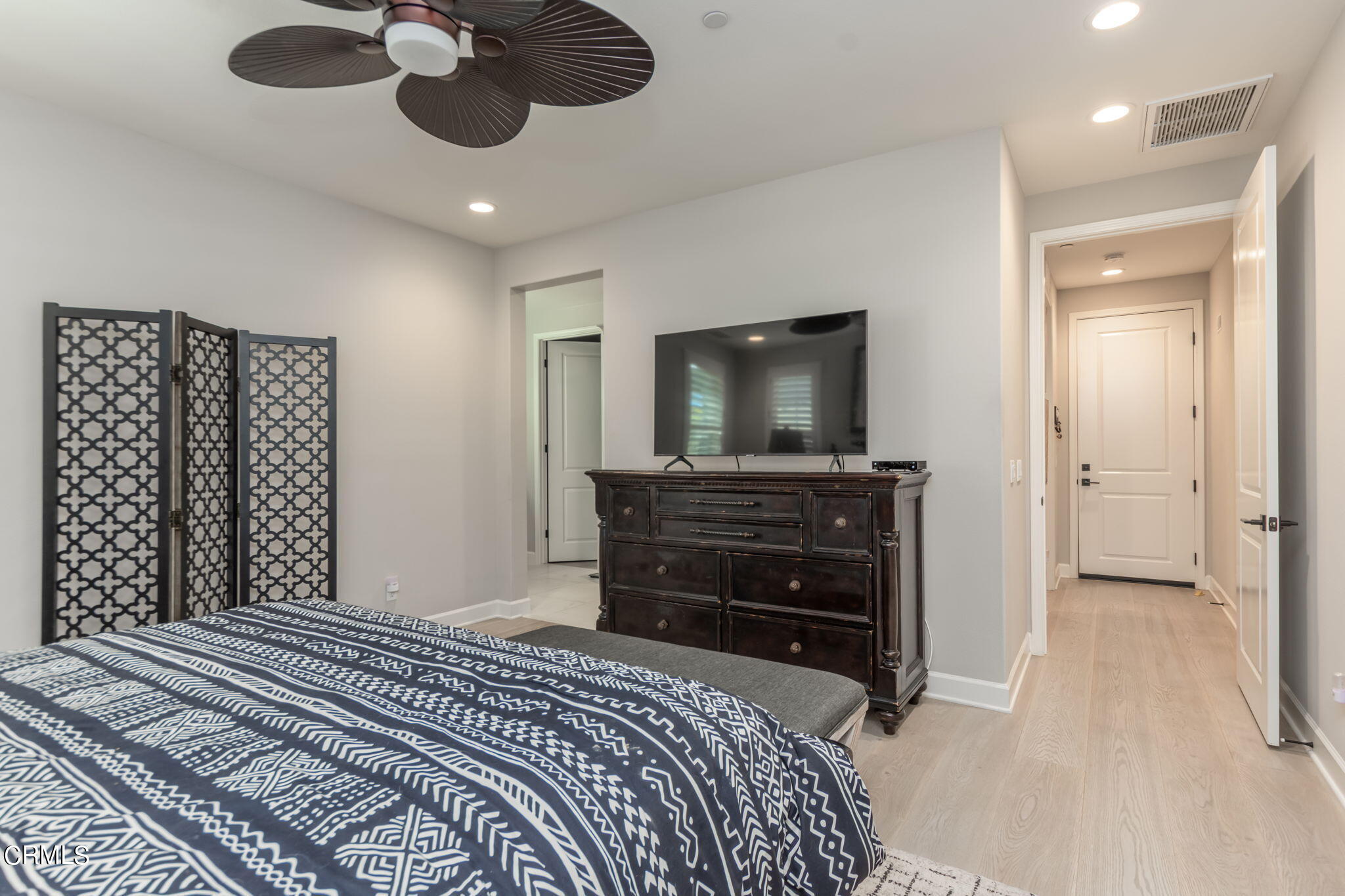 2474 Rondell Road Camarillo, CA 93012 - Photo 14 of 37 a bedroom with a bed and a flat tv screen on dresser