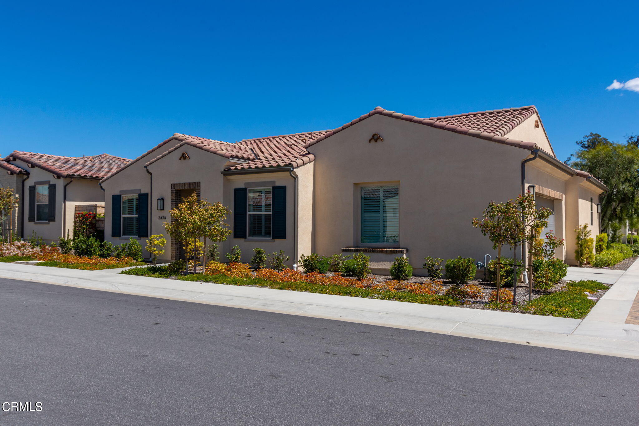 2474 Rondell Road Camarillo, CA 93012 - Photo 2 of 37 a front view of a house with a yard