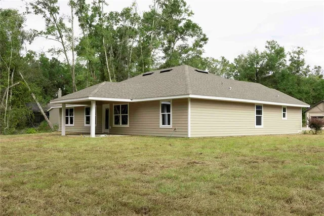 a front view of a house with yard