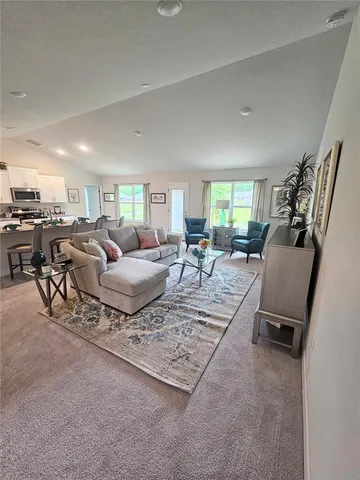 a living room with furniture and a rug
