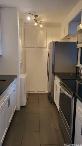 a close view of stove and microwave