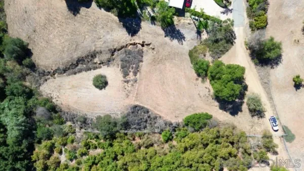 an aerial view of residential house with outdoor space