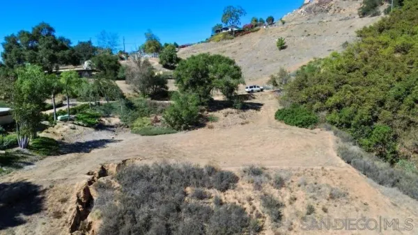 a view of a backyard of the house