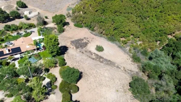 an aerial view of a backyard of a house