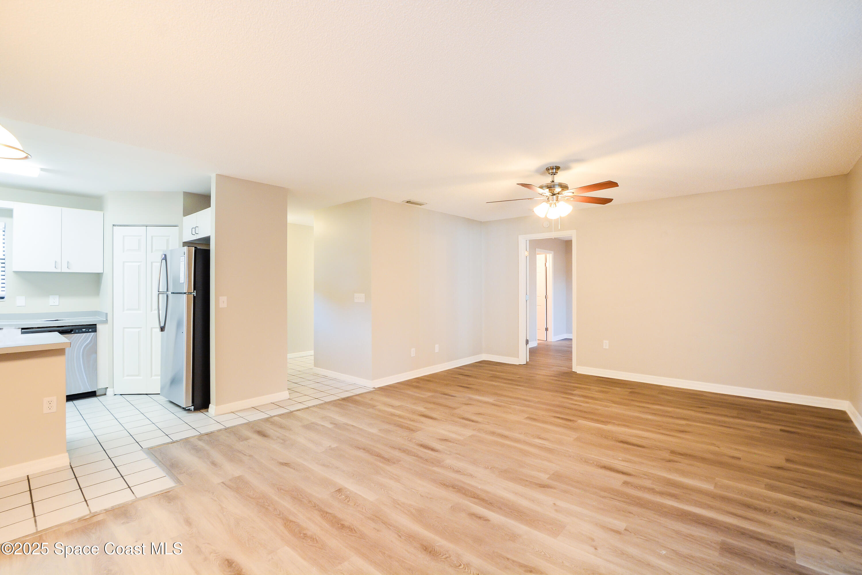 6005 Keystone Avenue Cocoa, FL 32927 - Photo 3 of 16 a view of a kitchen with a sink and a refrigerator