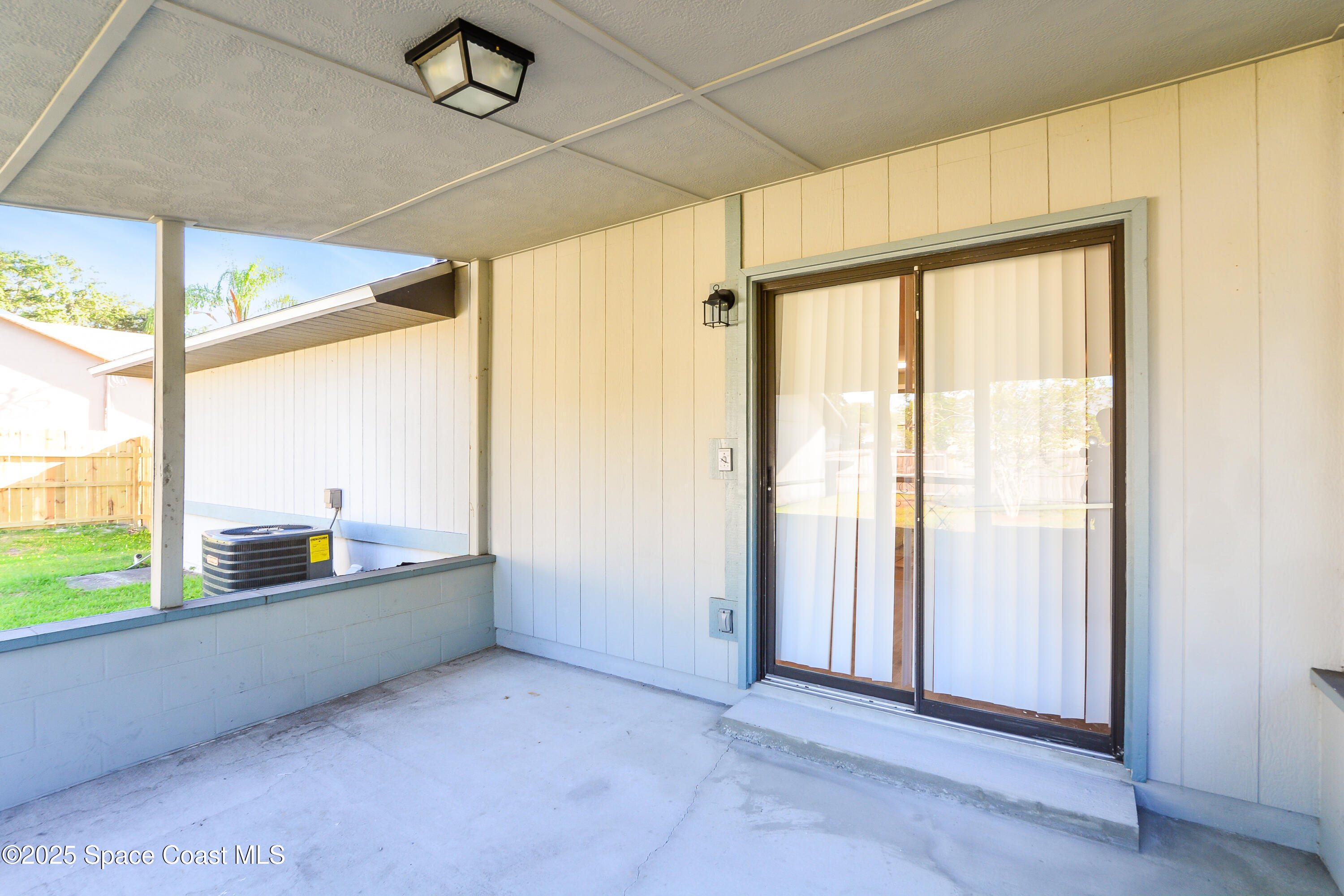 6005 Keystone Avenue Cocoa, FL 32927 - Photo 6 of 16 an empty room with large windows