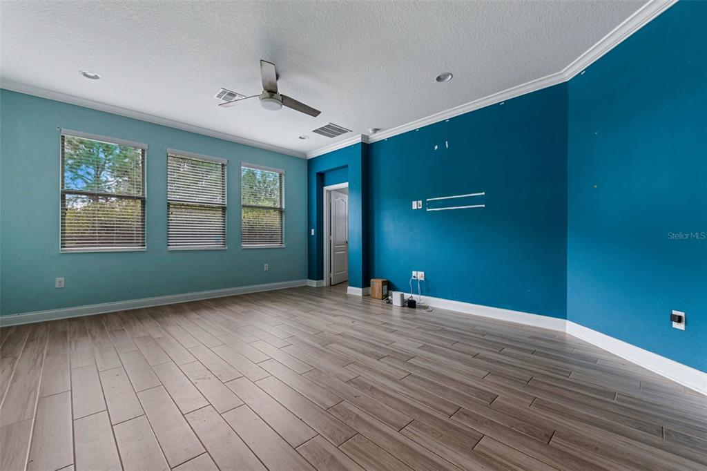 281 Ancona Avenue DeBary, FL 32713 - Photo 18 of 65 a view of an empty room with window and wooden floor
