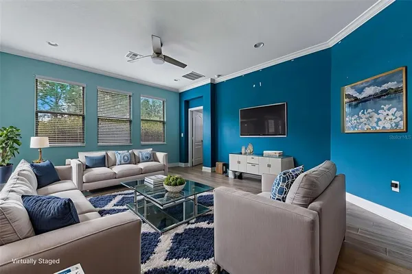 a living room with furniture and a flat screen tv