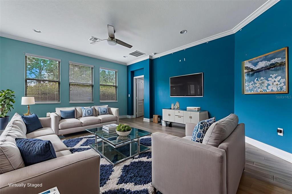 281 Ancona Avenue DeBary, FL 32713 - Photo 2 of 65 a living room with furniture and a flat screen tv