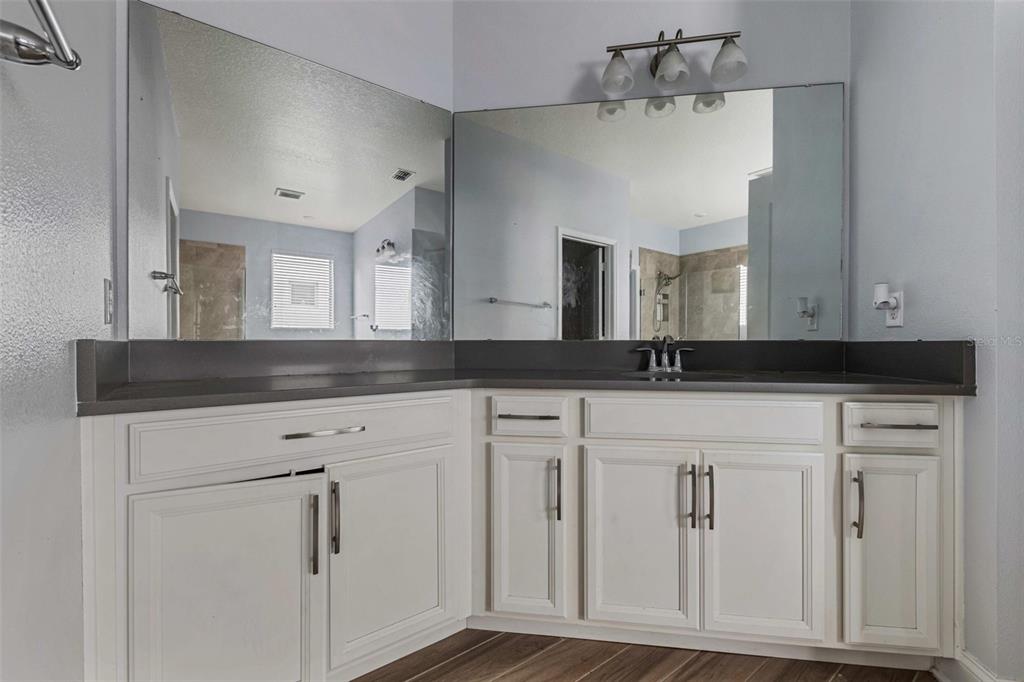 281 Ancona Avenue DeBary, FL 32713 - Photo 22 of 65 a bathroom with a sink vanity and mirror