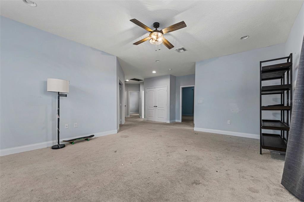 281 Ancona Avenue DeBary, FL 32713 - Photo 26 of 65 a view of an empty room with a ceiling fan