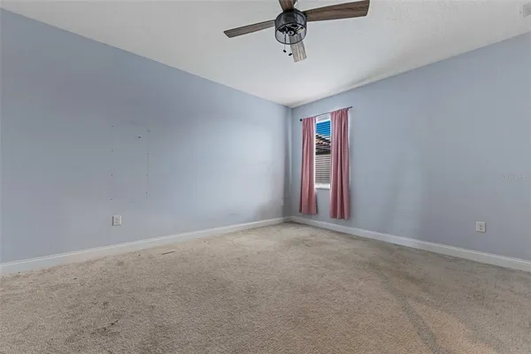 a view of an empty room with a fireplace