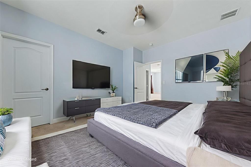 281 Ancona Avenue DeBary, FL 32713 - Photo 33 of 65 a bedroom with a bed and a flat screen tv