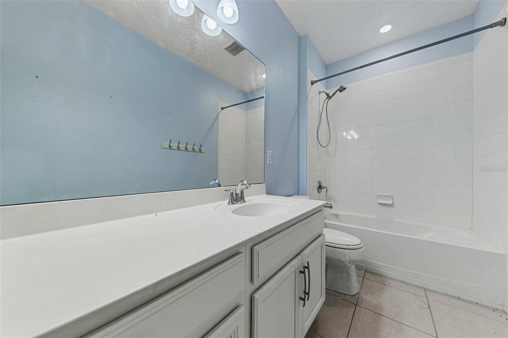 281 Ancona Avenue DeBary, FL 32713 - Photo 36 of 65 a bathroom with a sink a toilet and shower