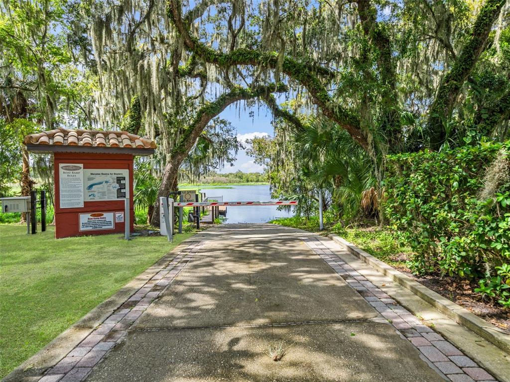 281 Ancona Avenue DeBary, FL 32713 - Photo 48 of 65 a front view of a house with a garden and trees