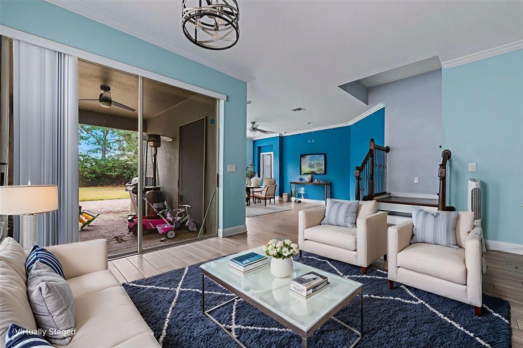 281 Ancona Avenue DeBary, FL 32713 - Photo 5 of 65 a living room with furniture a rug and a large window