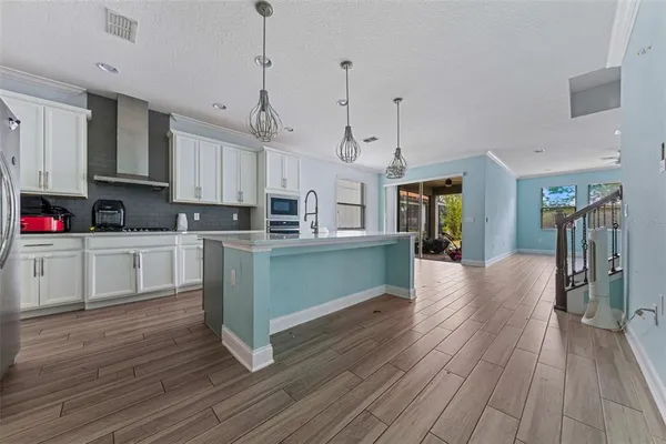 a kitchen with cabinets a sink and appliances