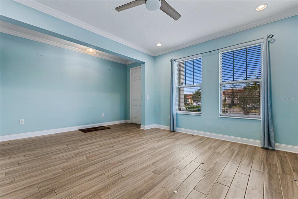 281 Ancona Avenue DeBary, FL 32713 - Photo 10 of 65 a view of an empty room with window and wooden floor