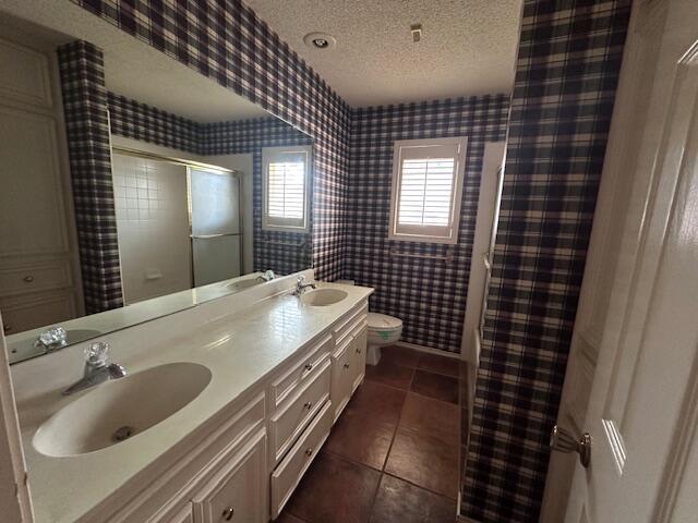 4610 91st Street Lubbock, TX 79424 - Photo 14 of 26 a bathroom with a sink and a shower