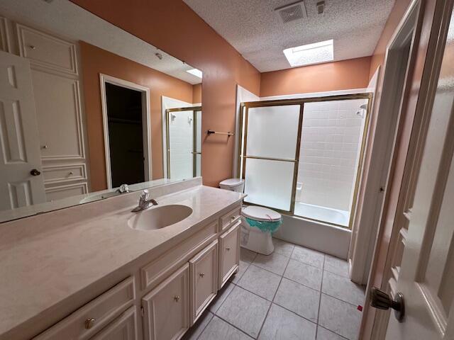 4610 91st Street Lubbock, TX 79424 - Photo 16 of 26 a bathroom with a sink a toilet and a shower