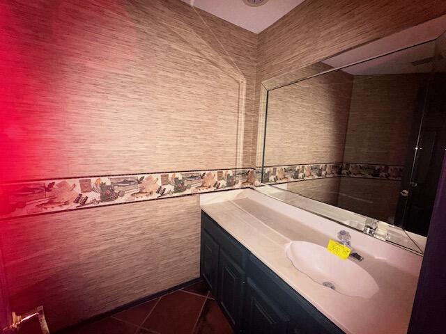 4610 91st Street Lubbock, TX 79424 - Photo 17 of 26 a bathroom with a sink and a mirror