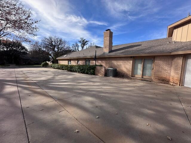 4610 91st Street Lubbock, TX 79424 - Photo 24 of 26 a front view of a house with a garden