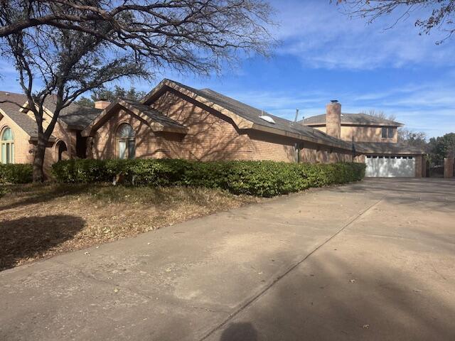 4610 91st Street Lubbock, TX 79424 - Photo 25 of 26 a view of a building with a yard