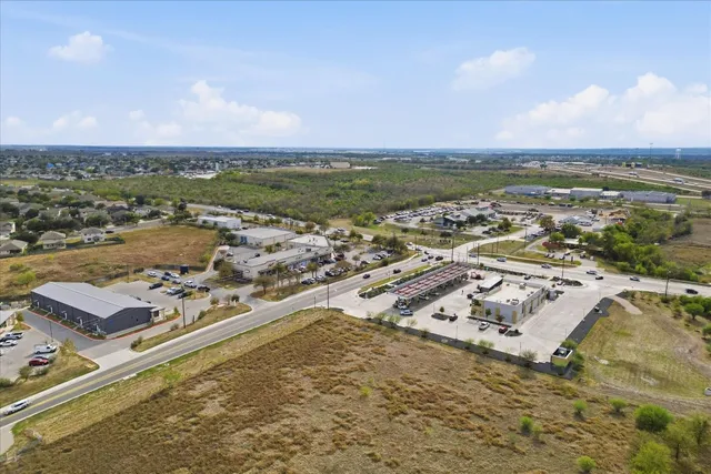 an aerial view of residential building with ocean view