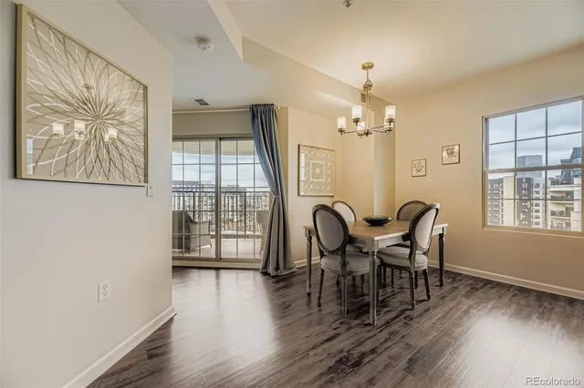 a view of a dining room with furniture window and wooden floor