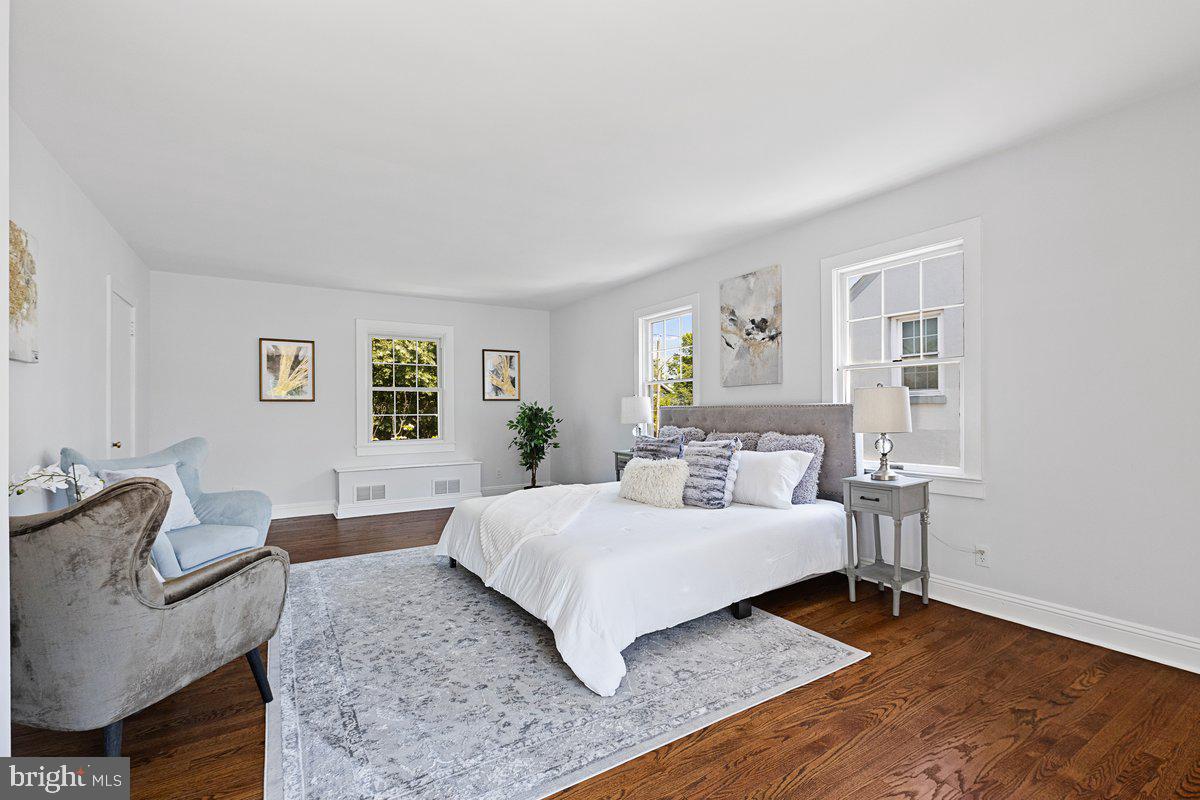 122 Linden Lane Princeton, NJ 08540 - Photo 11 of 19 a bedroom with a bed and wooden floor