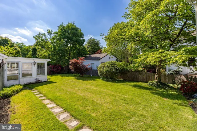 a view of a backyard with a small cabin