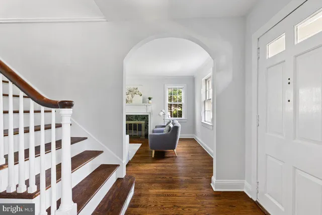 a view of an entryway with wooden floor
