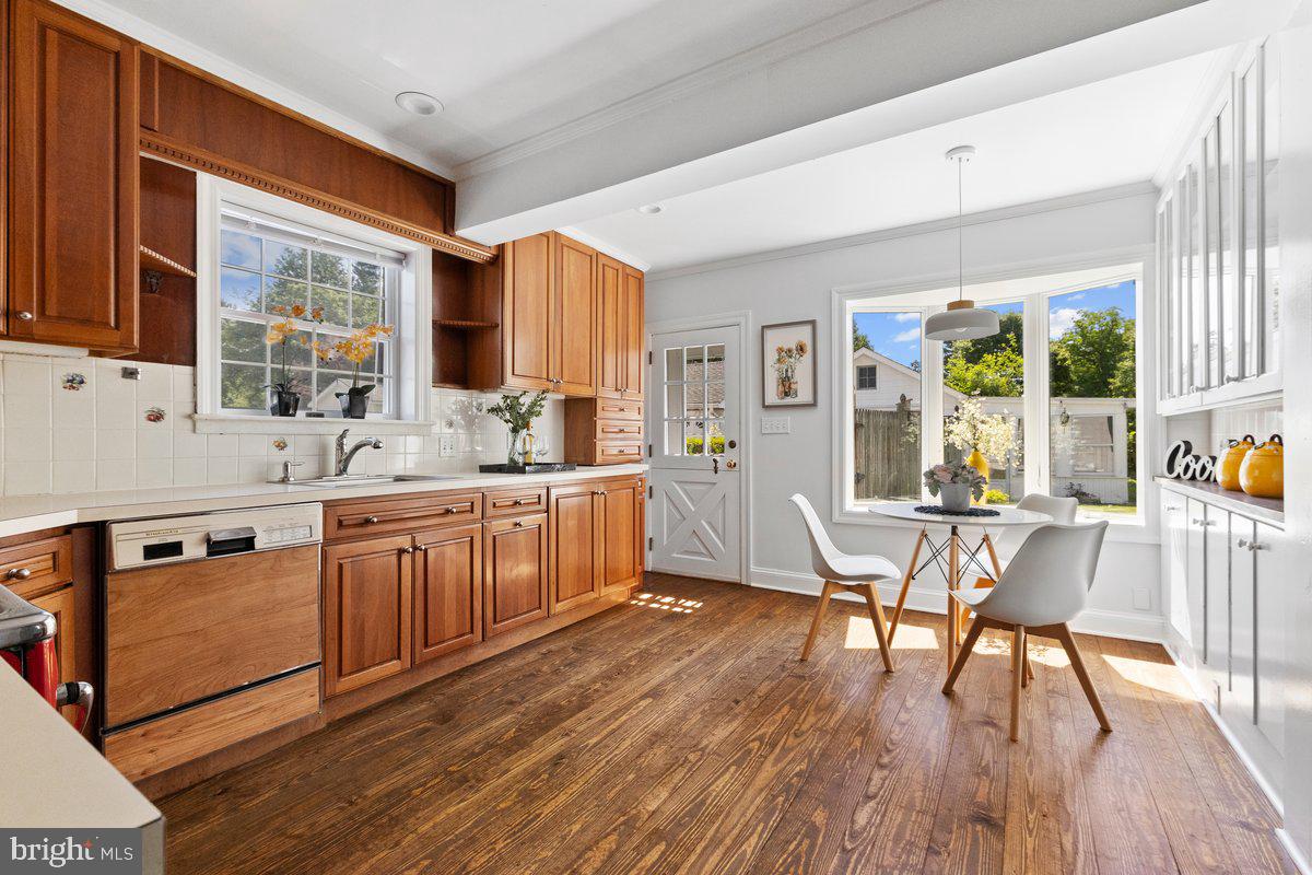 122 Linden Lane Princeton, NJ 08540 - Photo 5 of 19 a kitchen with stainless steel appliances granite countertop wooden floors and white cabinets