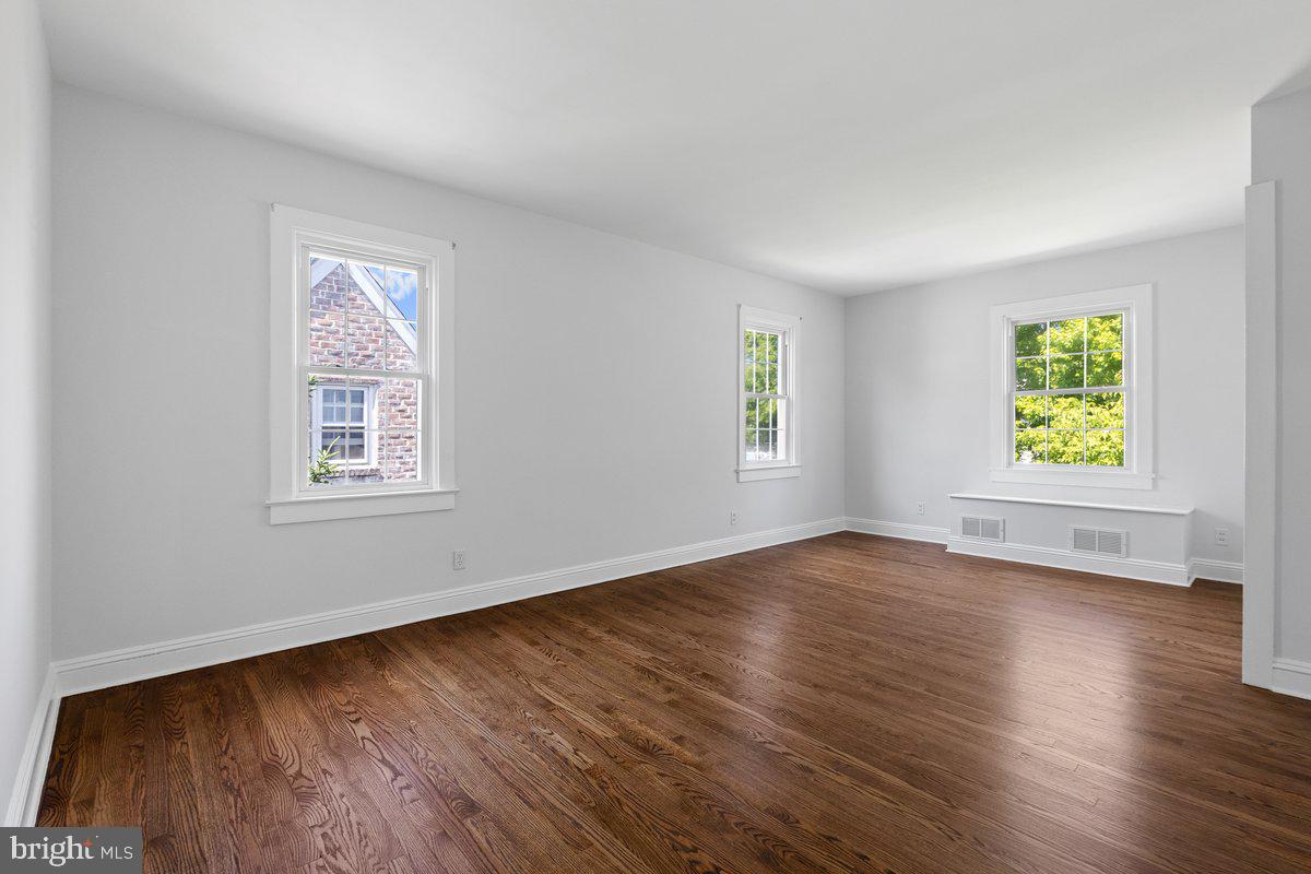 122 Linden Lane Princeton, NJ 08540 - Photo 9 of 19 a view of an empty room with window and wooden floor