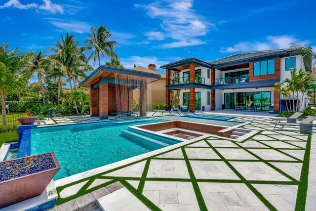 a spacious bedroom with a bed and a large window