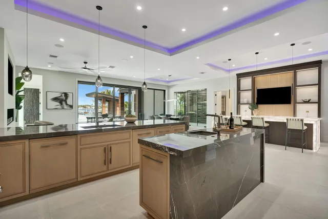 a living room with furniture and a air conditioner vent